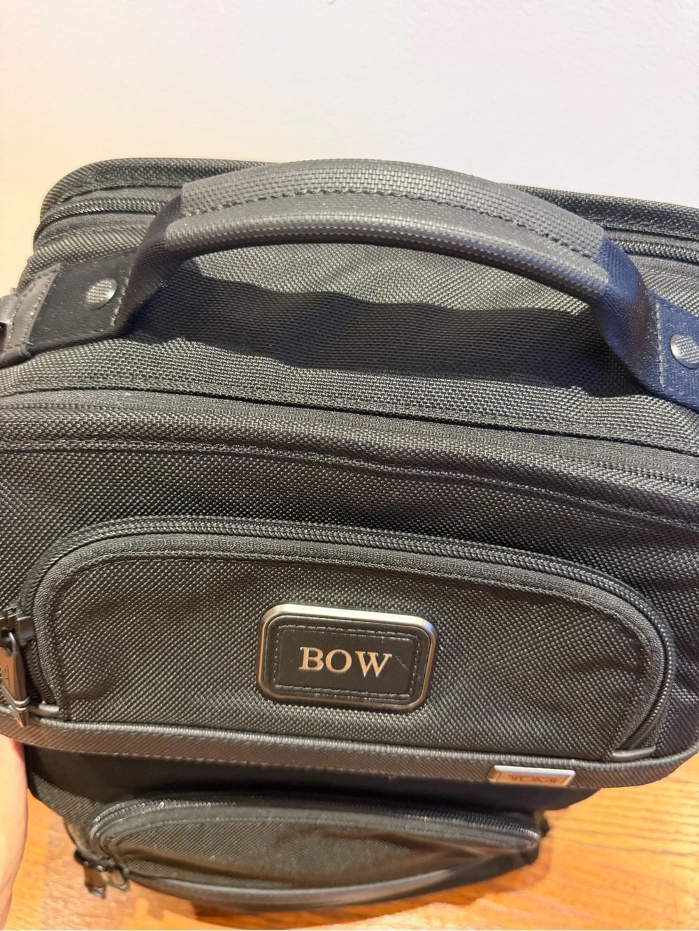 Tumi Black Backpack with Multiple Front Pockets